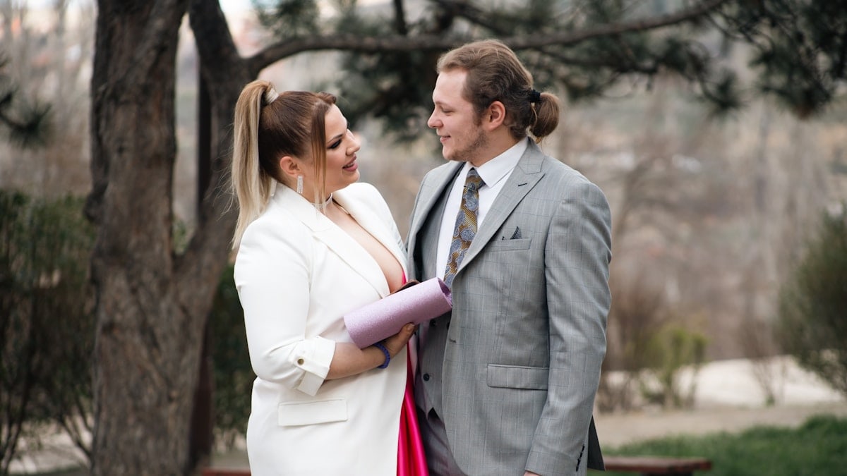 a man and a woman standing next to each other